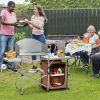 A Foldable Outdoor BBQ Portable Grilling Table with Windscreen Bag